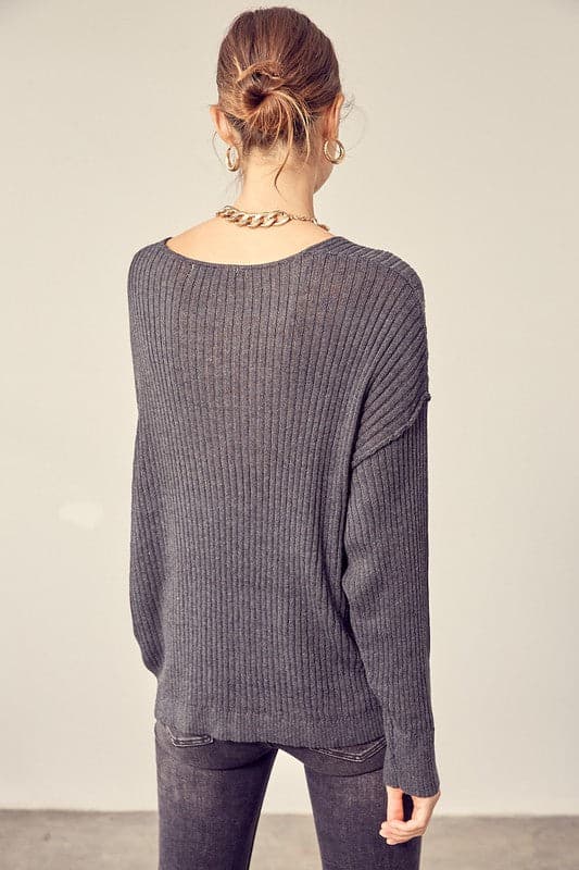 This comfy v neck knit top is the perfect transitional pice for all your fall outfits. Layer it over a cozy tank top and jeans or shorts for the weekend, or under a jacket when the fall weather settles in. This easy to style, chic knit pullover will look great with any wardrobe. Avah Couture