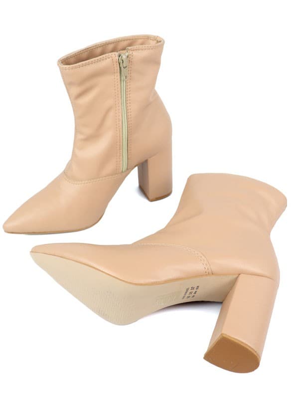 This pointed toe bootie is a chic and comfortable must have for fall. With its side zip closure, pointy toe and block heel this pair is ideal for your everyday needs. Pair it with your favorite look while the weather turns chilly! Avah Couture