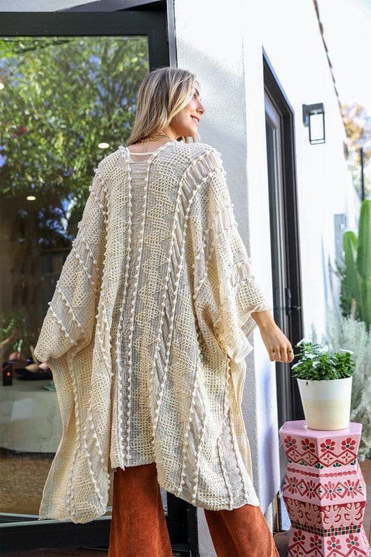 This beautiful kimono has an open front and is made out of 100% acrylic. The fabric is super soft and the unique zig zag pattern adds a fun twist and unique texture. This kimono is perfect for many occasions, top off your favorite OOTD with it! One size fits most. Avah Couture