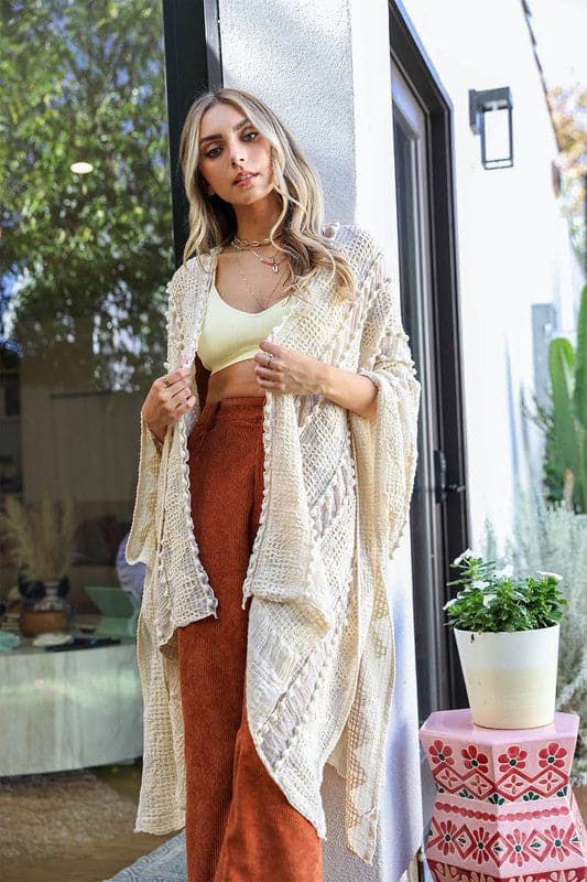 This beautiful kimono has an open front and is made out of 100% acrylic. The fabric is super soft and the unique zig zag pattern adds a fun twist and unique texture. This kimono is perfect for many occasions, top off your favorite OOTD with it! One size fits most. Avah Couture