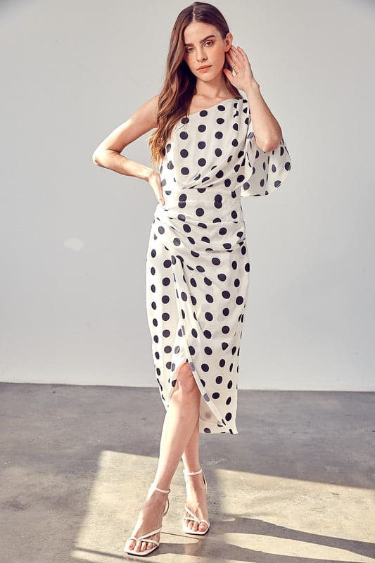 Add a chic touch to your spring wardrobe with this one-shoulder polka dot wrap dress. This on-trend piece features a classic silhouette that is simple, sleek, and sophisticated. This dress is perfect for work or the weekend and looks great paired with heels or flats! Avah Couture