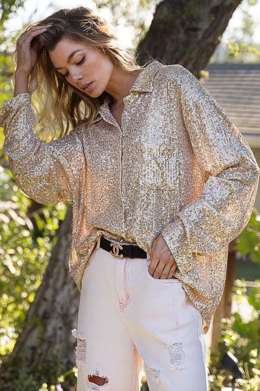 Avah Couture - Slay the day in our Shimmer & Shine Long Sleeve Shirt. It’s the perfect piece to complete any outfit. This shirt will make you stand out from the crowd with its sparkly sequin finish that adds a touch of glamour to your everyday look. The sequin adorned shirt is designed in white and pink or silver and rose, and features a relaxed fit for comfort, long sleeves for warmth, button closure, chest pocket, and clean hemline.  Relaxed Fit  Long Sleeves  Botton Closures  90% nylon and 10% spandex