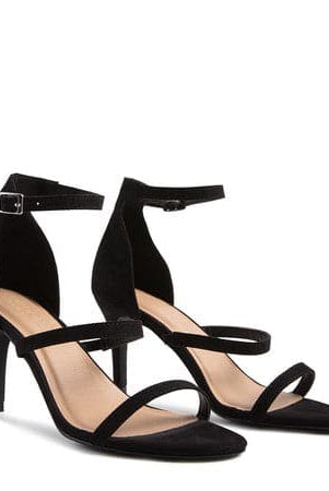 This round toe ankle strap sandal has a feminine and sexy 3 strap design, with a pin buckle fastening at the ankle. It features a mid heel, faux suede material, with a comfortable footbed. Perfect for wearing to work or a night out! Avah Couture