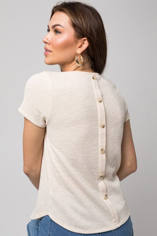 Look your best in this essential tee. It’s feminine, flattering and simple everything you. Need to make a statement. A round neckline and short sleeves give this piece a modern look while the back button detail adds interest. Wear it with your favorite pair of jeans or casual pants for an effortless style.