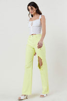 Look effortlessly stylish in these distressed wide-cut straight leg jeans. Featuring a high waist, wide leg, distressed front and 5-pocket construction. With an on-trend lime color, you’ll love how these jeans take your look to the next level - Avah Couture