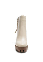 A must have for your fall and winter outfits, this pair of very stylish high heel boots will give you a fashion edge. With a block heel, pointy toe and side zipper detail, this boot is a show stopper. Crafted with quality materials, this ankle boot can be used for many season to come. Avah Couture