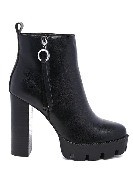 A must have for your fall and winter outfits, this pair of very stylish high heel boots will give you a fashion edge. With a block heel, pointy toe and side zipper detail, this boot is a show stopper. Crafted with quality materials, this ankle boot can be used for many season to come. Avah Couture