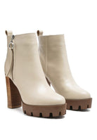 A must have for your fall and winter outfits, this pair of very stylish high heel boots will give you a fashion edge. With a block heel, pointy toe and side zipper detail, this boot is a show stopper. Crafted with quality materials, this ankle boot can be used for many season to come. Avah Couture