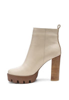 A must have for your fall and winter outfits, this pair of very stylish high heel boots will give you a fashion edge. With a block heel, pointy toe and side zipper detail, this boot is a show stopper. Crafted with quality materials, this ankle boot can be used for many season to come. Avah Couture