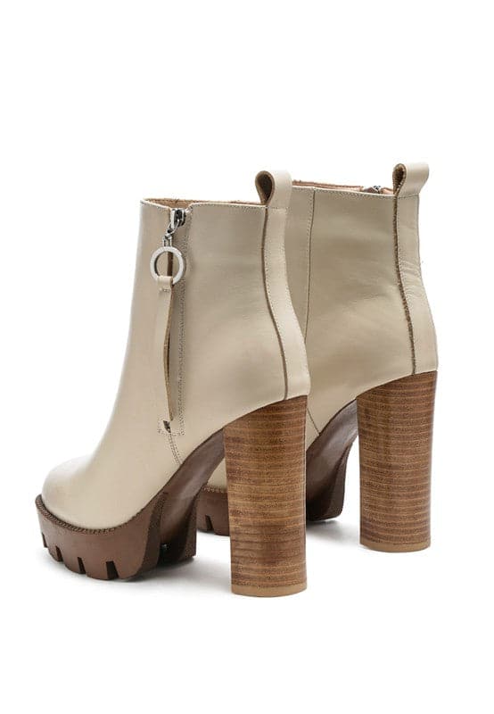 A must have for your fall and winter outfits, this pair of very stylish high heel boots will give you a fashion edge. With a block heel, pointy toe and side zipper detail, this boot is a show stopper. Crafted with quality materials, this ankle boot can be used for many season to come. Avah Couture