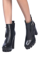 A must have for your fall and winter outfits, this pair of very stylish high heel boots will give you a fashion edge. With a block heel, pointy toe and side zipper detail, this boot is a show stopper. Crafted with quality materials, this ankle boot can be used for many season to come. Avah Couture
