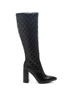Winter season is the perfect time to step into a pair of stylish, chic and elegant boots. The knee high block heeled boot is sophisticated footwear to have. This elegant pointed toe boot in block heel comes with side zipper opening and made in high quality soft PU. These high boots are quilted and have a supreme finish. Avah Couture