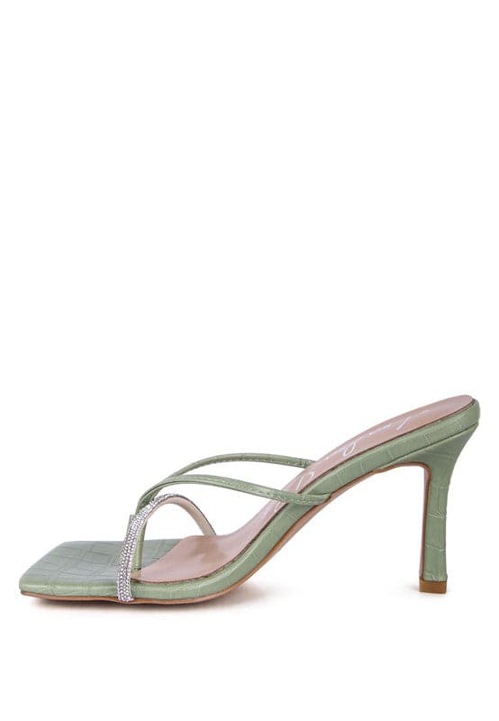 If you’re looking for a stylish, trendy and feminine sandal, you have found it. These mid heel sandals with a rhinestone encrusted strap are both beautiful and comfortable. Grab one in taupe or mint color - Avah Couture