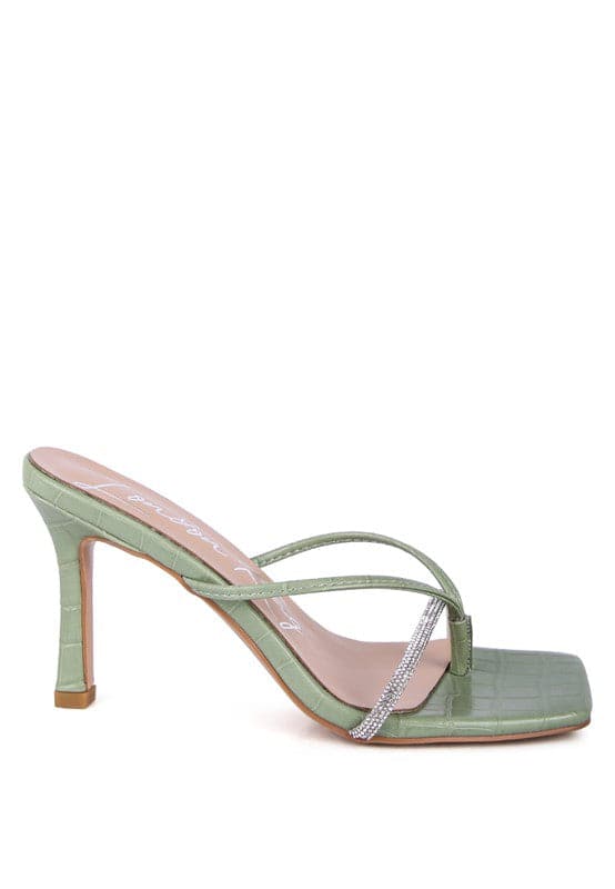 If you’re looking for a stylish, trendy and feminine sandal, you have found it. These mid heel sandals with a rhinestone encrusted strap are both beautiful and comfortable. Grab one in taupe or mint color - Avah Couture