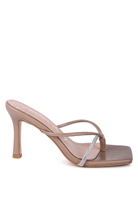 If you’re looking for a stylish, trendy and feminine sandal, you have found it. These mid heel sandals with a rhinestone encrusted strap are both beautiful and comfortable. Grab one in taupe or mint color - Avah Couture