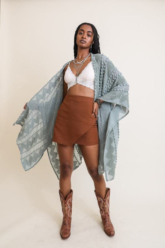 This beautiful kimono has an open front and is made out of 100% acrylic. The fabric is super soft and the unique zig zag pattern adds a fun twist and unique texture. This kimono is perfect for many occasions, top off your favorite OOTD with it! One size fits most. Avah Couture