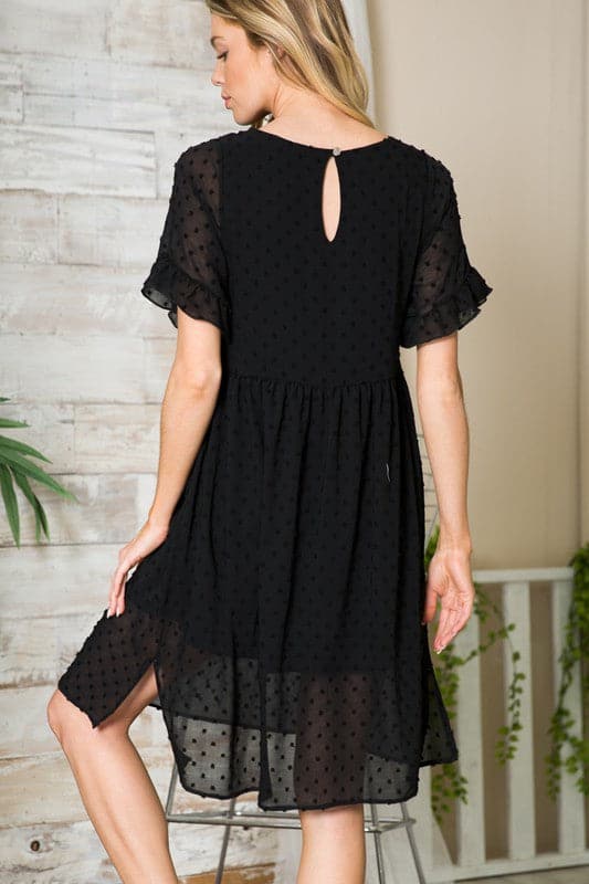 This flowy little dress is made from a textured chiffon that drapes beautifully, showing off your curves and making you feel extra cute. The ruffle sleeve detail adds femininity, while the button back provides coverage. An elastic shirred waist and side slits add an element of comfort and style. Easily transition from work to play with this gorgeous dress! Avah Couture