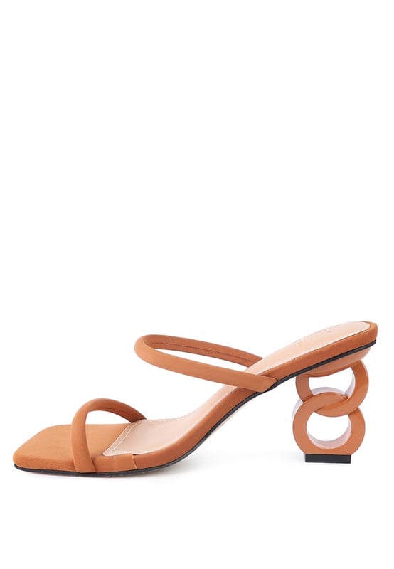 The Eternity is a double-strap sandal with a unique resin chain heel that adds a new dimension to this classic style. This mid-heel sandal is feminine, fun, and a perfect addition to your shoe collection.  Avah Couture