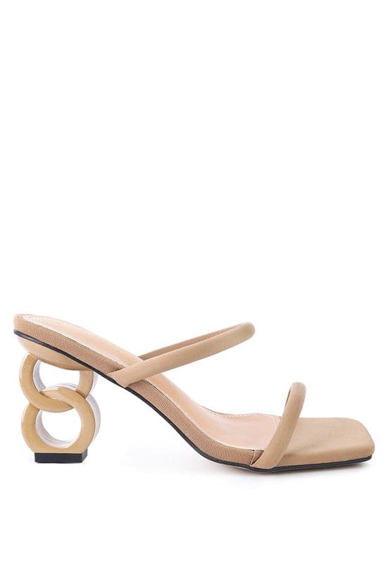 The Eternity is a double-strap sandal with a unique resin chain heel that adds a new dimension to this classic style. This mid-heel sandal is feminine, fun, and a perfect addition to your shoe collection.  Avah Couture