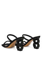 The Eternity is a double-strap sandal with a unique resin chain heel that adds a new dimension to this classic style. This mid-heel sandal is feminine, fun, and a perfect addition to your shoe collection.  Avah Couture