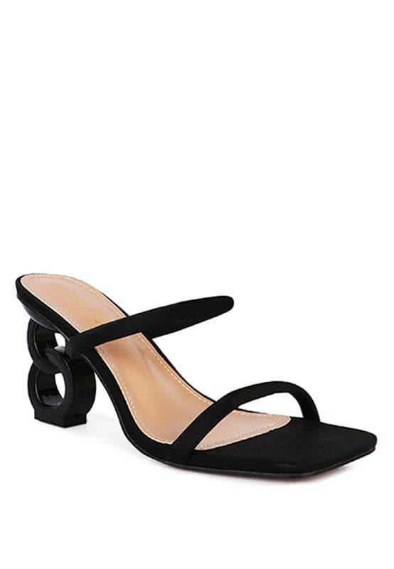 The Eternity is a double-strap sandal with a unique resin chain heel that adds a new dimension to this classic style. This mid-heel sandal is feminine, fun, and a perfect addition to your shoe collection.  Avah Couture