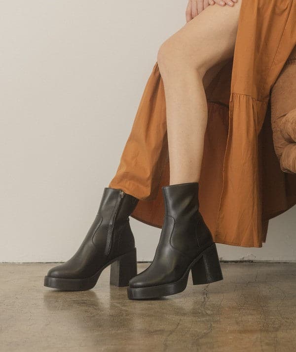 A relaxed take on the everyday bootie that’s made a stand out with a chunky heel. These will take you throughout the ups and downs of an ordinary day in style. Designed with a sleek, minimalist toe and an oversized heel, these ankle boots will take your style to a whole new level. Slim enough to pair with your favorite jeans or skirts, but substantial enough to pull off over a pair of thick socks when the weather turns chilly.  Avah Couture