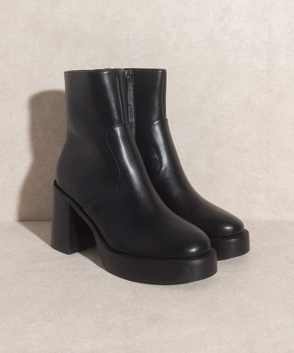 A relaxed take on the everyday bootie that’s made a stand out with a chunky heel. These will take you throughout the ups and downs of an ordinary day in style. Designed with a sleek, minimalist toe and an oversized heel, these ankle boots will take your style to a whole new level. Slim enough to pair with your favorite jeans or skirts, but substantial enough to pull off over a pair of thick socks when the weather turns chilly.  Avah Couture