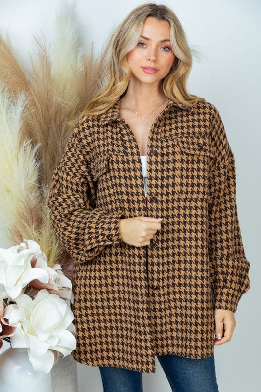 This houndstooth jacket is the perfect way to style casual chic looks for fall. It features a relaxed fit, long sleeves and collared button down front with pockets. The woven fabric ensures a stylish, quality look and it’s great for layering over your jeans or leggings. Avah Couture
