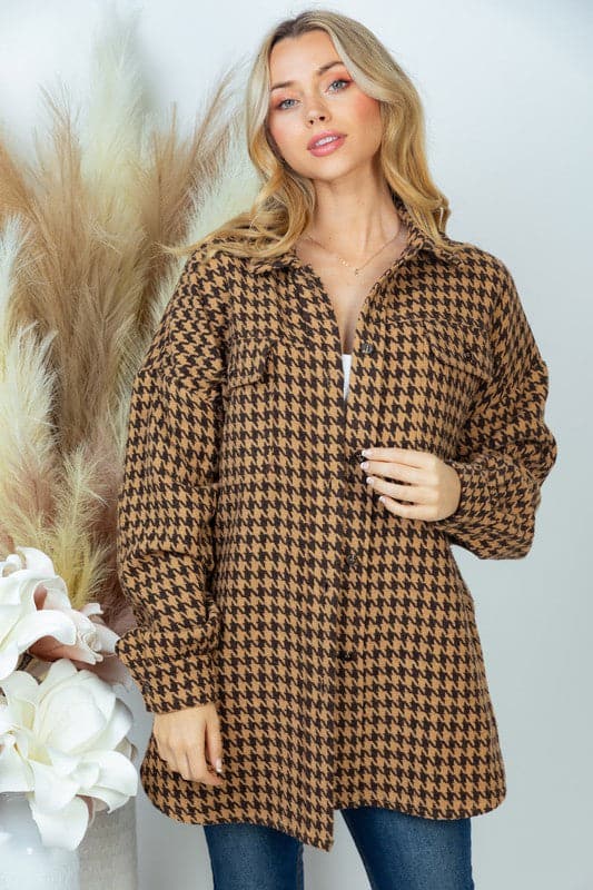 vThis houndstooth jacket is the perfect way to style casual chic looks for fall. It features a relaxed fit, long sleeves and collared button down front with pockets. The woven fabric ensures a stylish, quality look and it’s great for layering over your jeans or leggings. Avah Couture