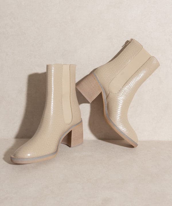 With a nod to Chelsea vintage roots and a perfect fit for the modern woman, the Lily is an effortlessly cool ankle boot. Crafted in rustic neutral tones, it comes with a block heel and elastic panel for easy pull on wear and comfort. Avah Couture