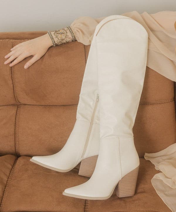 This is the perfect boot for any occasion, especially when you want to make a statement. The Callie wears like a dream with the perfect panels, a pointed toe and 3.5 inch high heel. Knee high cowboy boots anyone? Yes please! Avah Couture