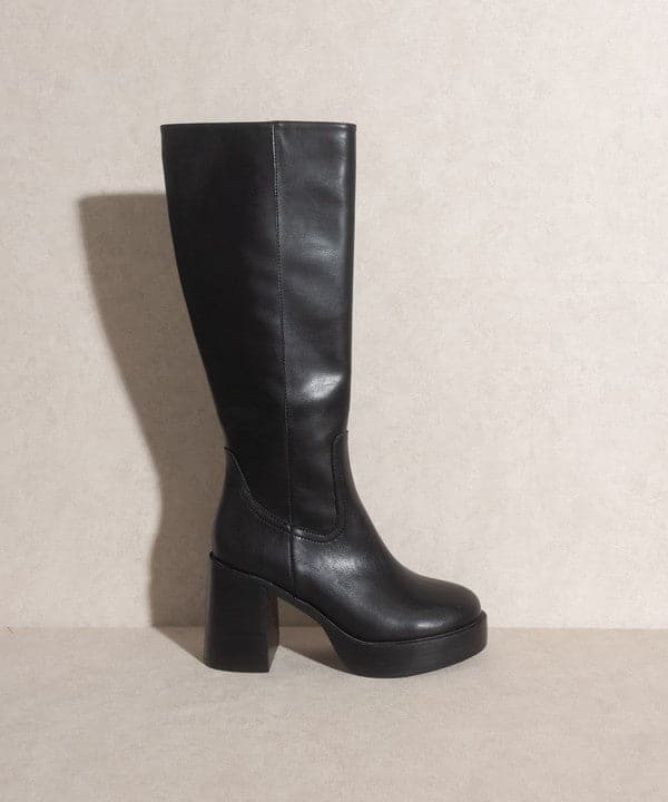 The Sadie Platform Knee High Boots are seriously cool. This pair is tall, slim cut, placed on a chunky heel, and ready for anywhere you want to go. With a minimalist style, these boots will have you feeling vintage and retro everywhere you go. Wear them with anything from dresses and jeans to skirts, shorts or your favorite legging. 