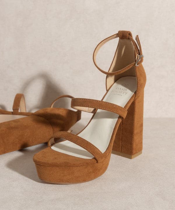 Luxurious simplicity at its finest, the Raelynn is a statement heel designed to elevate your look. The stunning suede upper features open toe styling, as well as an ultra high platform and 5” heel height. Furture classics for your everyday wardrobe!