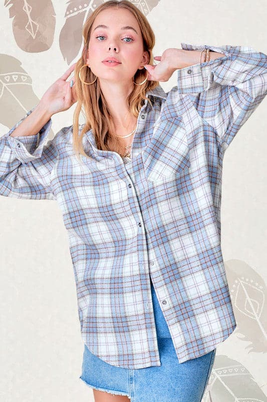 Everyday comfort meets stylish design in this soft and lightweight flannel shirt. The long sleeves, buttoned cuffs, and patch pocket at the chest create a classic look perfect for your all your casual wear.  Avah Couture