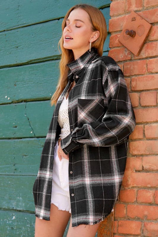 Your new favorite flannel! This oversized checkered plaid shirt is an essential top to add to your closet. Featuring a nice, oversize silhouette and subtle distressing at the sleeves and hemline. This plaid flannel shirt has long sleeves, full button front and will add effortless style to your wardrobe. Great paired with everything from denim to trousers, this comfy flannel shirt is great for loungewear days or weekend wear!  Avah Couture