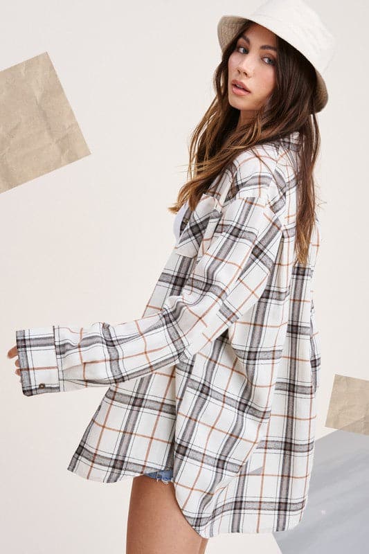 A classic plaid shirt is a staple you’ll wear all year long. Featuring a collar with a button down front, chest pocket, and long sleeves that you can roll up or down. Made with an oversized fit for an easy, effortless vibe.  Avah Couture