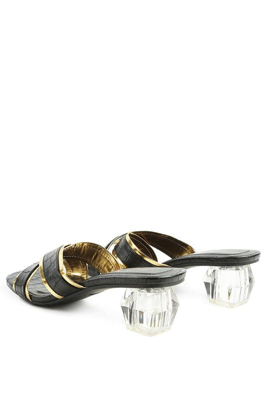 Set yourself apart from the rest with these stunning metallic outlined slides. The sculpted clear heel adds a touch of luxury, and the croc textured upper gives them a statement-making finishing touch-Avah Couture