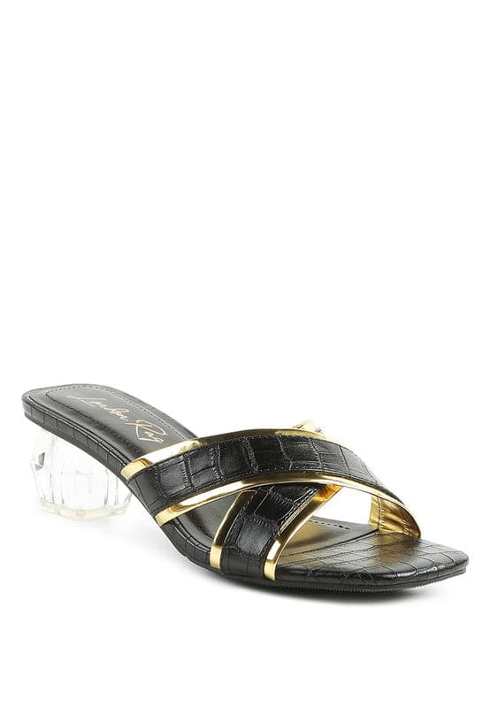 Set yourself apart from the rest with these stunning metallic outlined slides. The sculpted clear heel adds a touch of luxury, and the croc textured upper gives them a statement-making finishing touch-Avah Couture