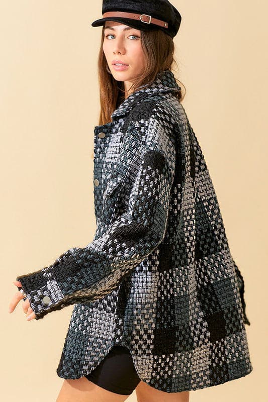Give your daytime look an effortless update with this checked coat. Featuring a brushed material, oversized fit and long sleeve design, this piece is perfect for autumn and looks great over jeans or leather leggings.  Avah Couture