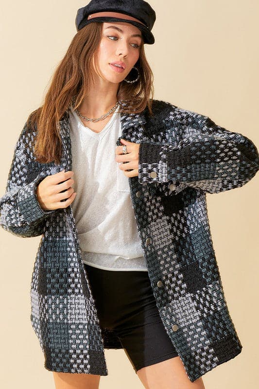 Give your daytime look an effortless update with this checked coat. Featuring a brushed material, oversized fit and long sleeve design, this piece is perfect for autumn and looks great over jeans or leather leggings.  Avah Couture