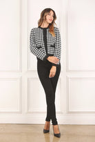 A classic piece that has timeless style, the Black And White Check Jacket is a must have this season. The heavy weight knit fabric features a black and white check pattern that gives it its name. A perfect balance of comfort and style, this jacket features 4 front snap buttons and 2 functional pockets. Wear it with your favorite outfit to work or play a classic piece to get you through any occasion! Avah Couture