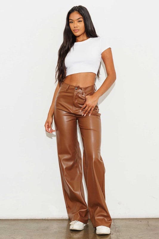 Show off what you’ve got in our chic, wide leg pants. Made out of supple vegan leather, they’re flattering and daring the perfect style for the modern woman who doesn’t play by the rules. Cognac color. Avah Couture