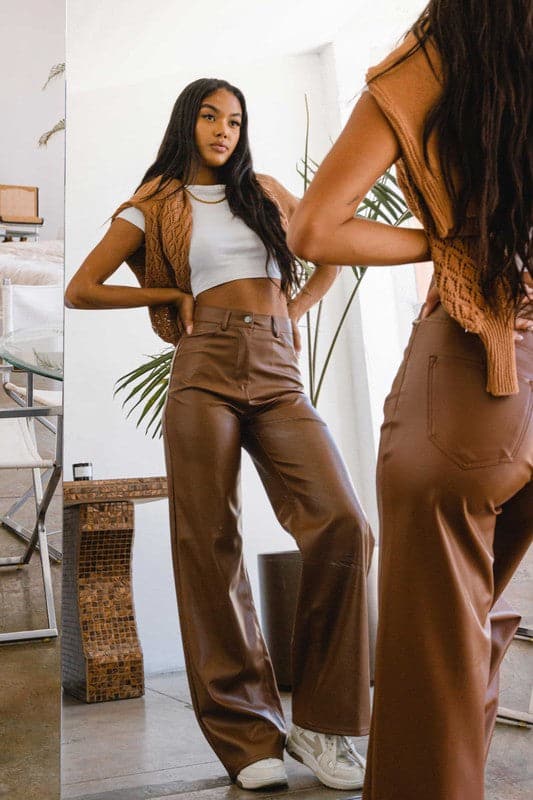 Show off what you’ve got in our chic, wide leg pants. Made out of supple vegan leather, they’re flattering and daring the perfect style for the modern woman who doesn’t play by the rules. Cognac color. Avah Couture
