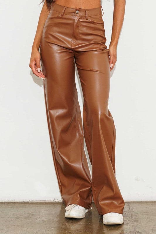Show off what you’ve got in our chic, wide leg pants. Made out of supple vegan leather, they’re flattering and daring the perfect style for the modern woman who doesn’t play by the rules. Cognac color. Avah Couture