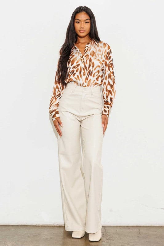 Show off what you’ve got in our chic, wide leg pants. Made out of supple vegan leather, they’re flattering and daring the perfect style for the modern woman who doesn’t play by the rules. Cream color. 