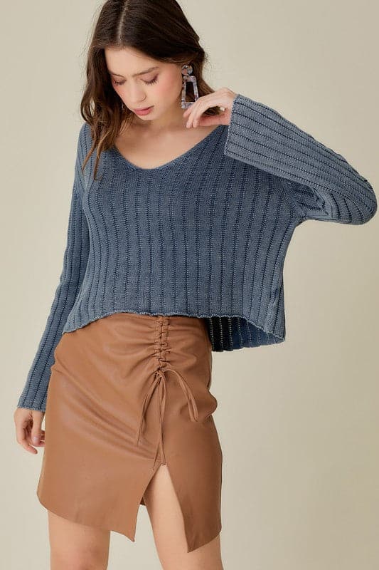 This knitted pullover is the perfect piece for you to wear in any season. With a loose and relaxed fit, it is designed to be paired with anything from jeans to shorts to skirts to dresses. It features a cropped style, which allows you to dress it up or down. It also has a v neck front which adds an elegant touch for those more formal affairs. In short, this sweater is versatile and can be worn by anyone at anytime in any environment. Avah Couture