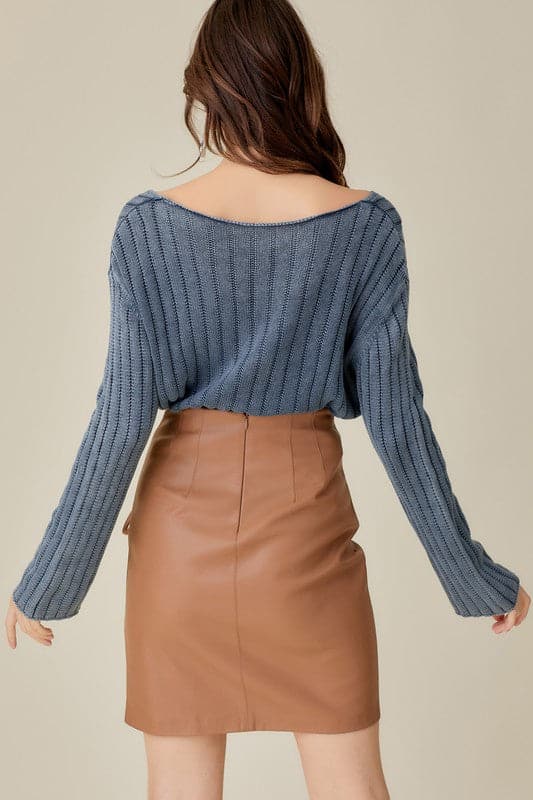 This knitted pullover is the perfect piece for you to wear in any season. With a loose and relaxed fit, it is designed to be paired with anything from jeans to shorts to skirts to dresses. It features a cropped style, which allows you to dress it up or down. It also has a v neck front which adds an elegant touch for those more formal affairs. In short, this sweater is versatile and can be worn by anyone at anytime in any environment. Avah Couture