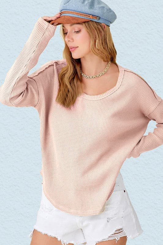 Who said casual can’t be stylish? This long sleeve top will give you that ease of mind look, with its waffle knit fabric and raw edge details. Perfect for everyday wear! Avah Couture