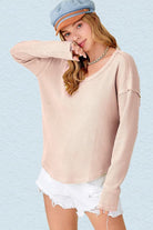 Who said casual can’t be stylish? This long sleeve top will give you that ease of mind look, with its waffle knit fabric and raw edge details. Perfect for everyday wear! Avah Couture