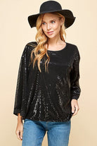 Celebrate any special occasion in this festive top! Featuring a solid sequin design, round neck and bell sleeves, as well as full lining, it’s the perfect addition to your party wardrobe. Perfect for celebrating the holidays! Avah Couture